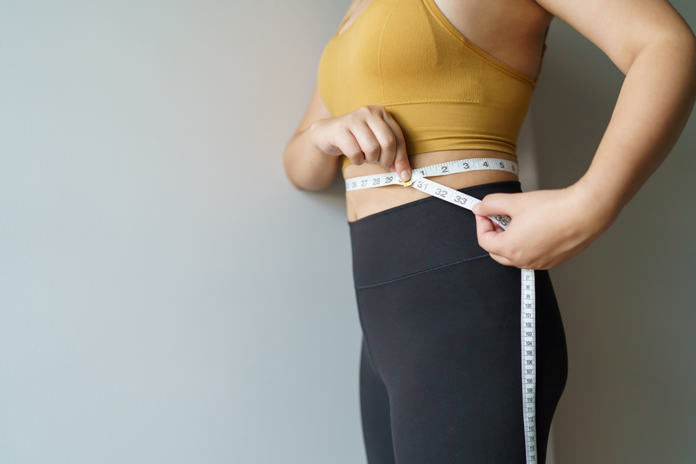 Woman using resistance equipment — a beginner's guide to body toning