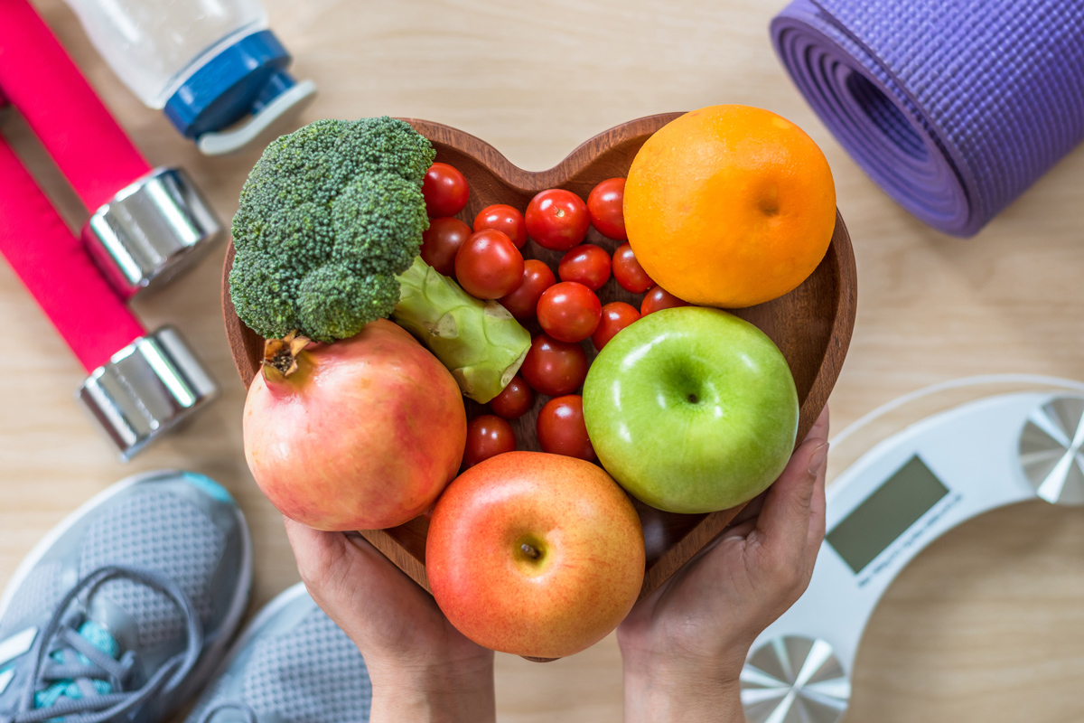 Fresh fruit in a heart-shaped bowl — nutrition for body toning