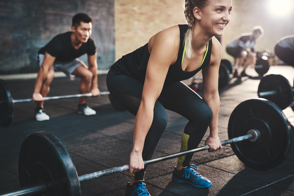 Woman strength training with dumbbells