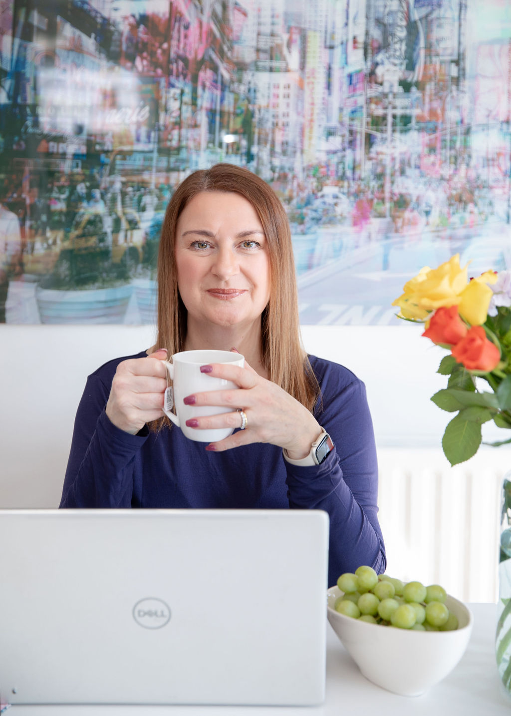 Suzy planning a bespoke wedding fitness programme at her laptop