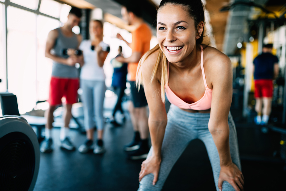 Woman working out with weights at home